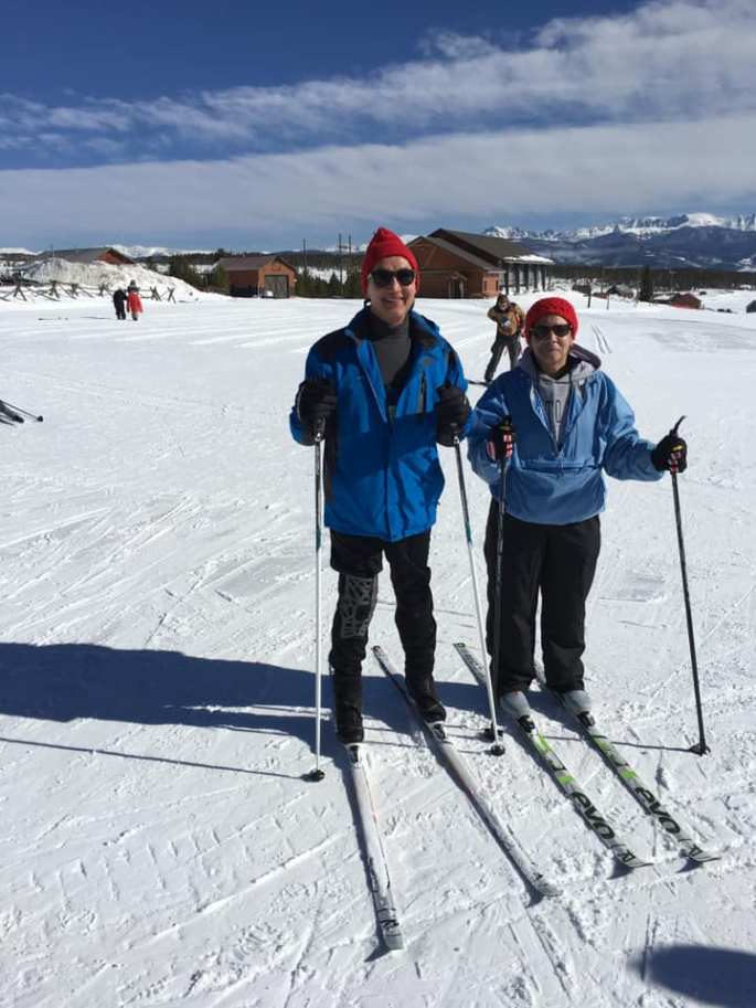 Michael and Cuqui standing in their skis after a mornings run on the trails