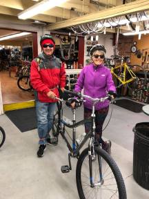 Michael and Janice standing next to tandem bike at Brown Cycle Shop